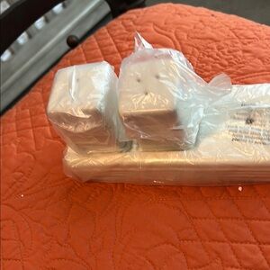 Nora Fleming brand new in wrapper and box. Salt and pepper and holder